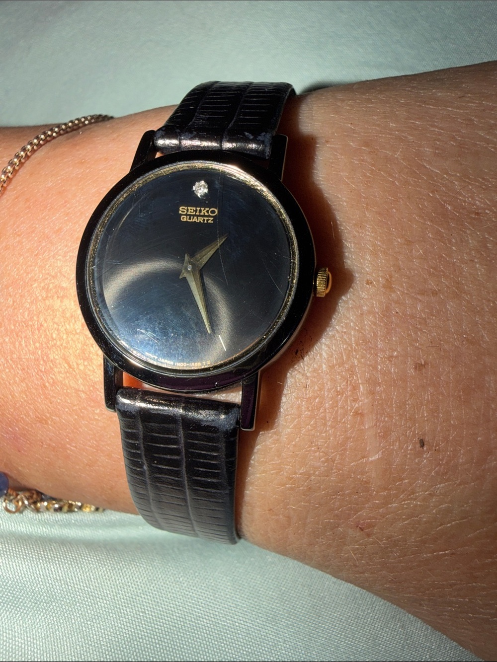 Seiko Black Dial Watch with Gold-Tone Accents